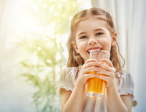 A beautiful girl drinking fresh juice