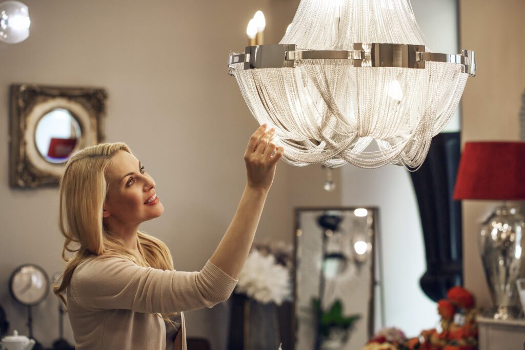 Mature beautiful woman shopping for chandelier E14
