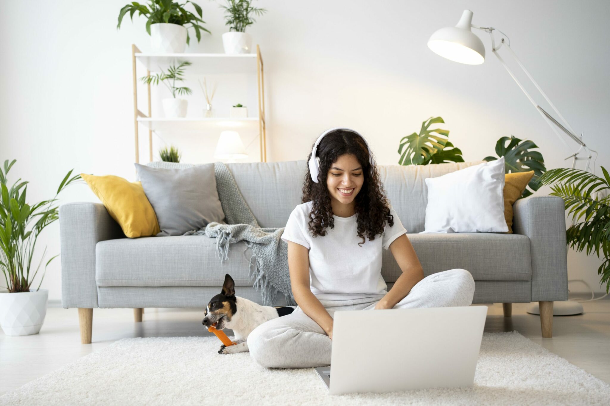 Full Shot Smiley Woman Floor With Laptop
