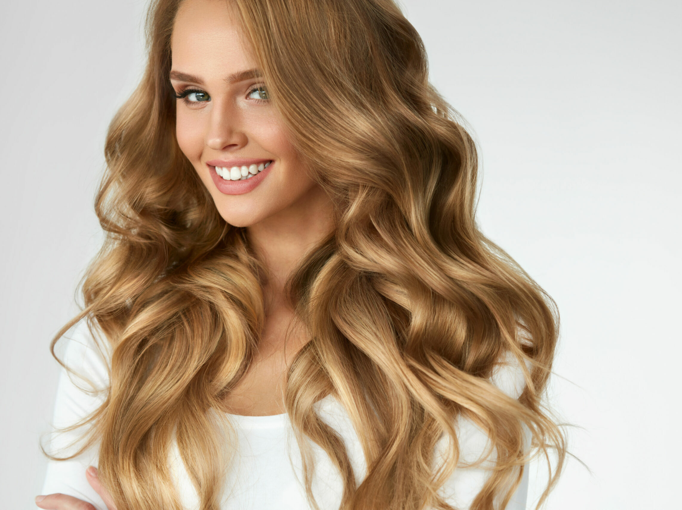 Beautiful Curly Hair. Girl With Wavy Long Hair Portrait. Volume